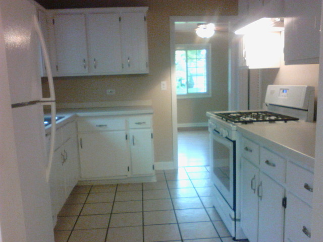9 Crescent Road Lake Zurich, IL 60047 - Photo 2 of 14 a kitchen with a stove a sink and a refrigerator