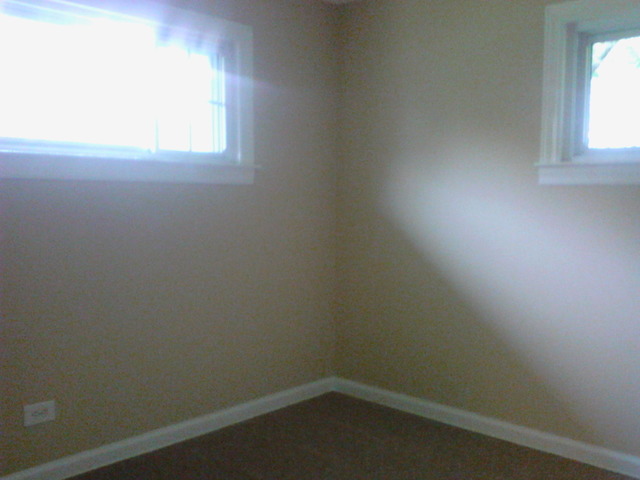 9 Crescent Road Lake Zurich, IL 60047 - Photo 7 of 14 an empty room with a window