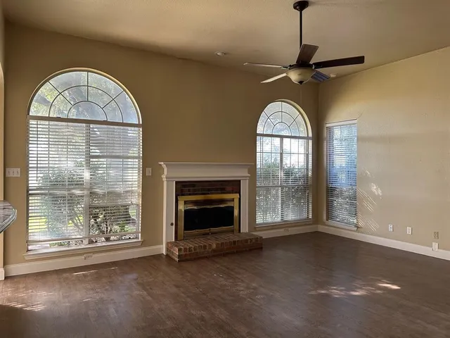 a view of a livingroom with furniture and a fireplace