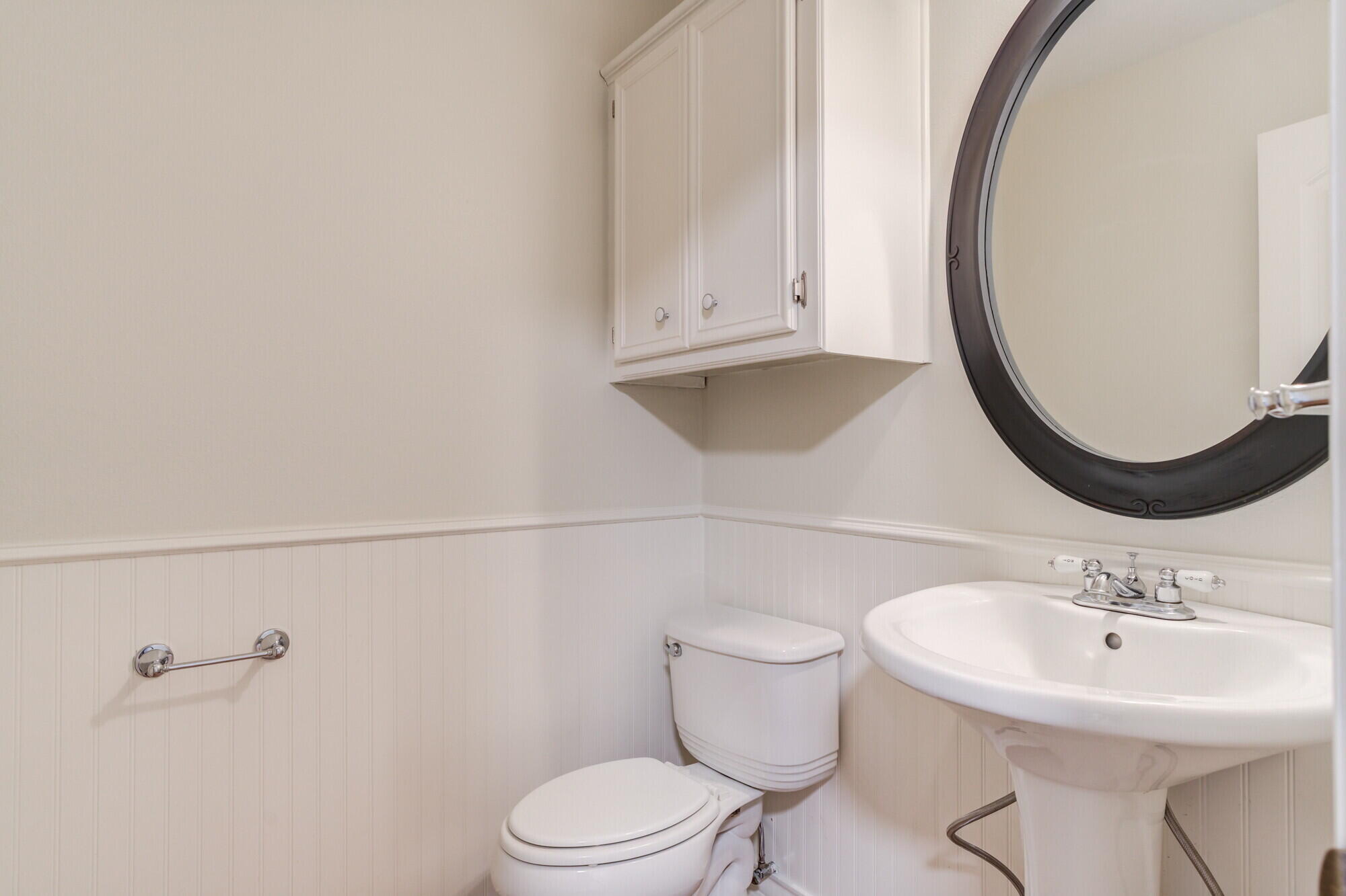 5309 77th Street Lubbock, TX 79424 - Photo 24 of 36 a bathroom with a sink a toilet and a mirror