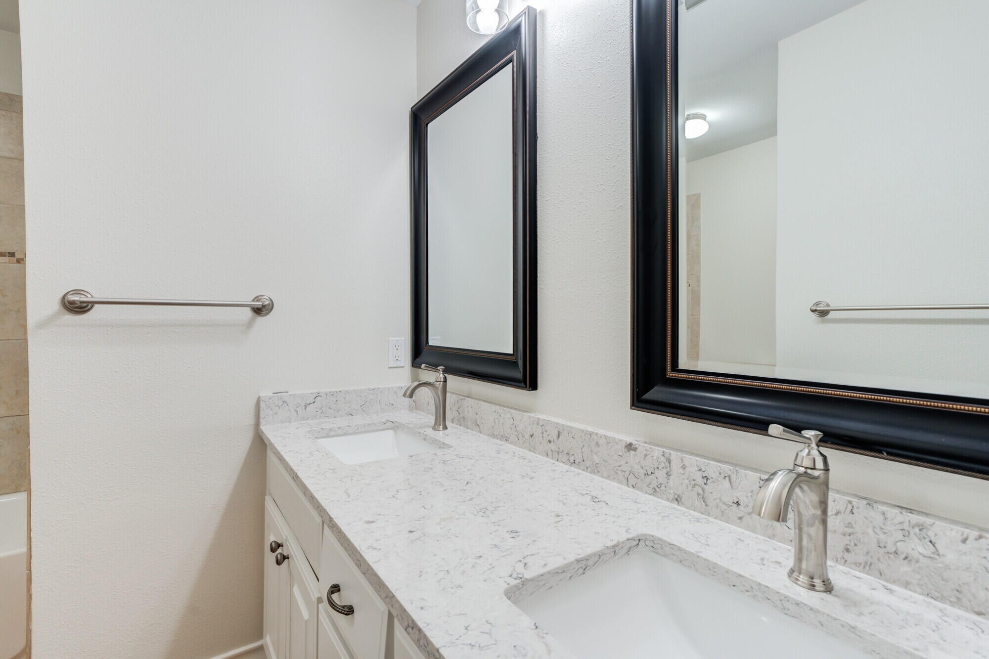 5309 77th Street Lubbock, TX 79424 - Photo 26 of 36 a bathroom with a sink and a mirror