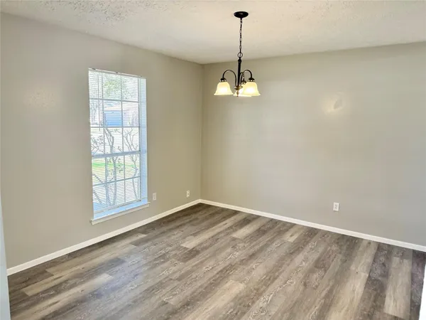 a view of empty room with windows