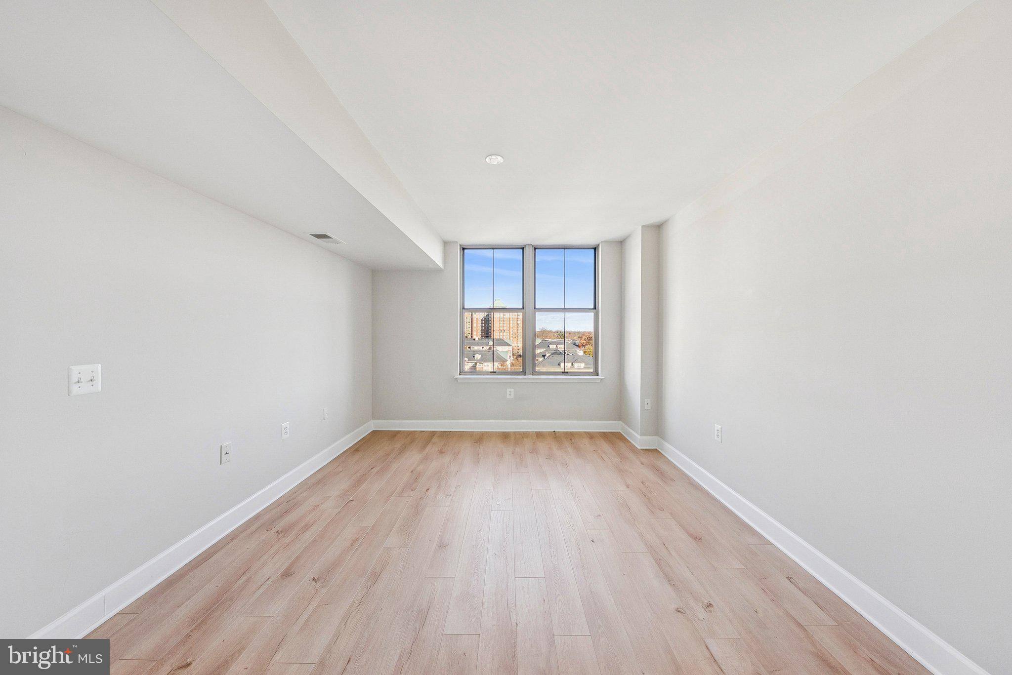 11800 Sunset Hills Road, Unit 1125 Reston, VA 20190 - Photo 13 of 24 a view of an empty room and window