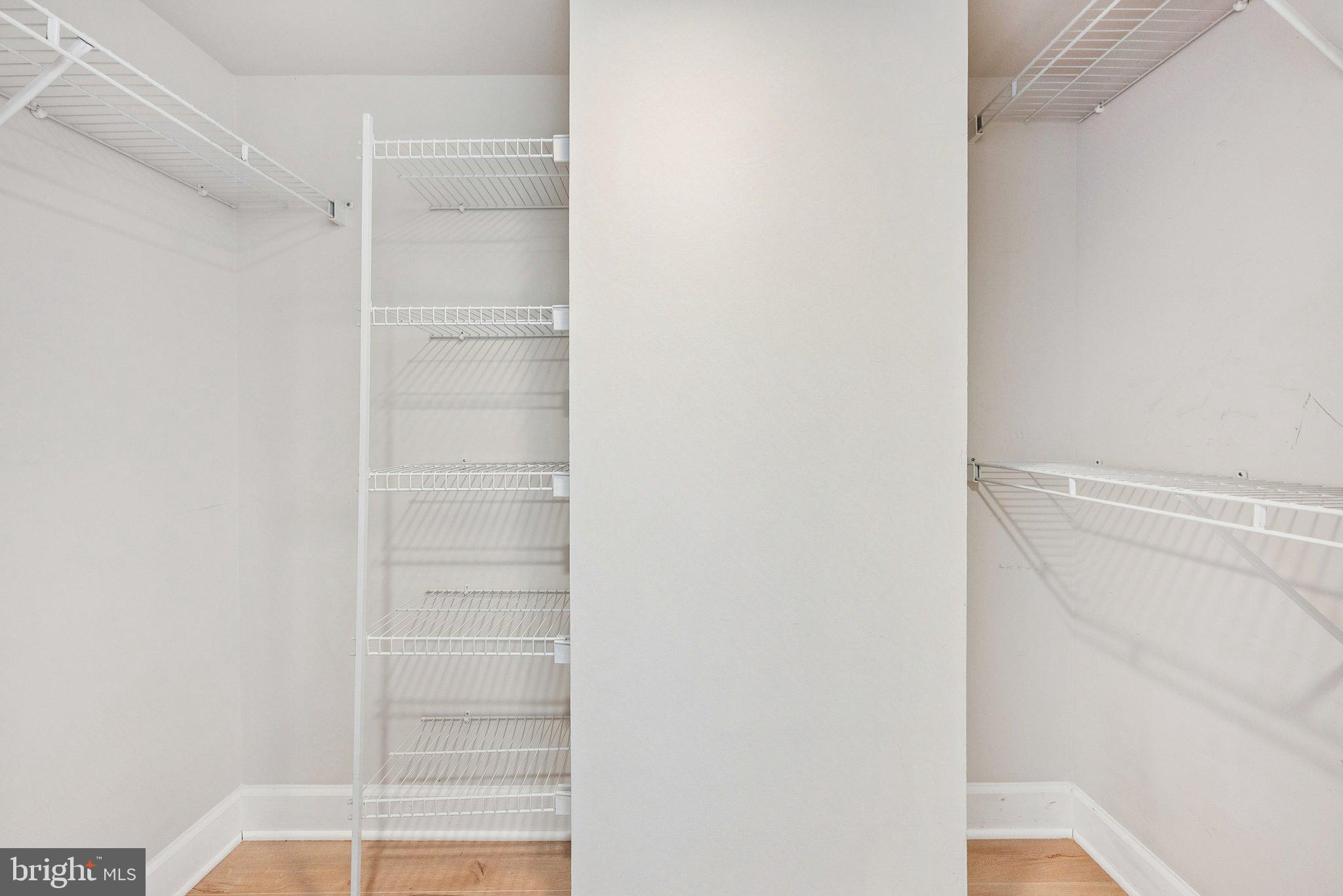 11800 Sunset Hills Road, Unit 1125 Reston, VA 20190 - Photo 16 of 24 a view of walk in closet with empty racks