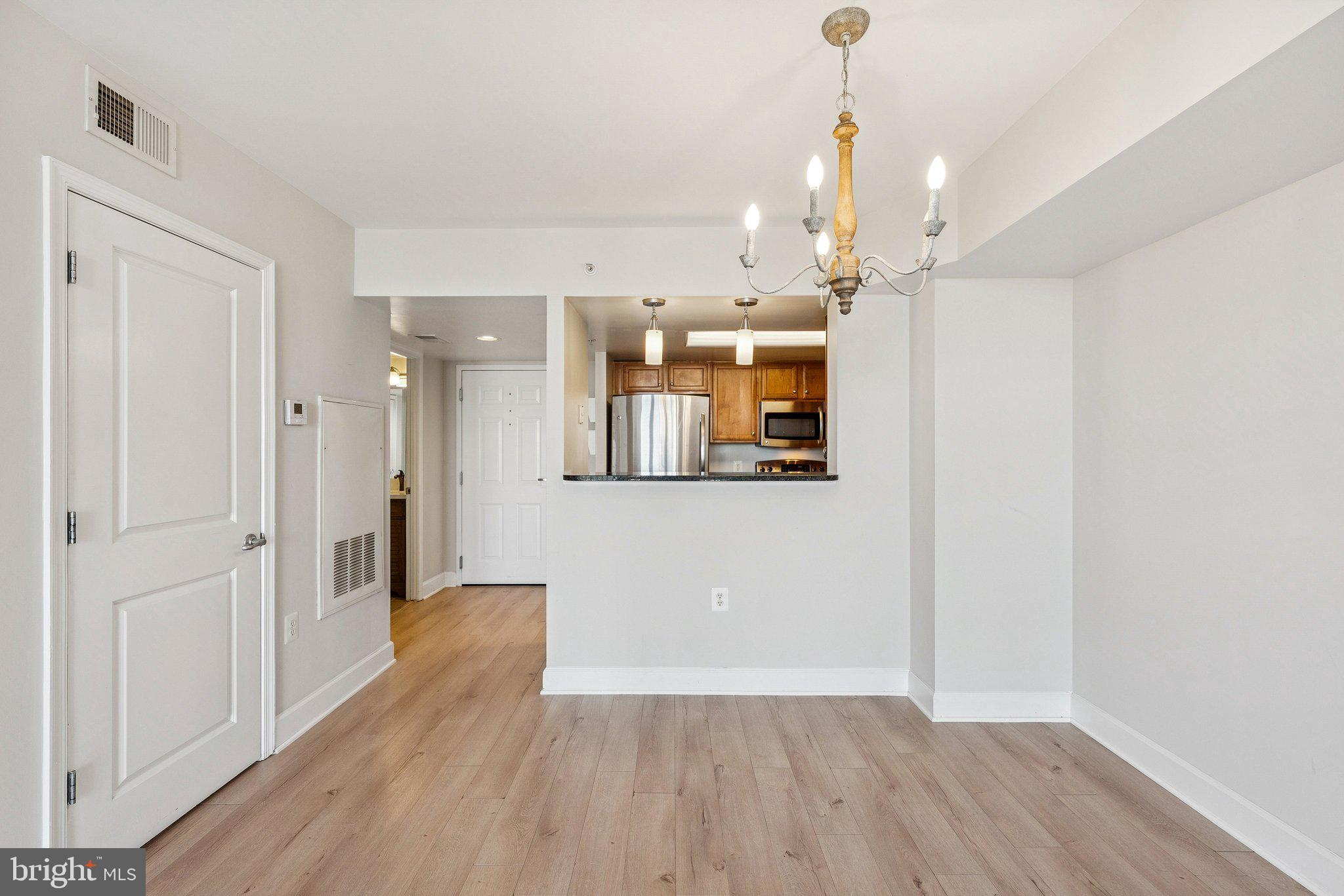 11800 Sunset Hills Road, Unit 1125 Reston, VA 20190 - Photo 5 of 24 a view of a hallway with wooden floor