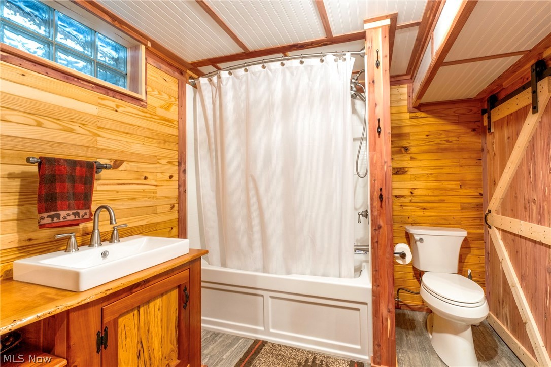 8360 Roller Road Salem, OH 44460 - Photo 28 of 45 Bathroom featuring wood-finish wall paneling and a white beadboard ceiling