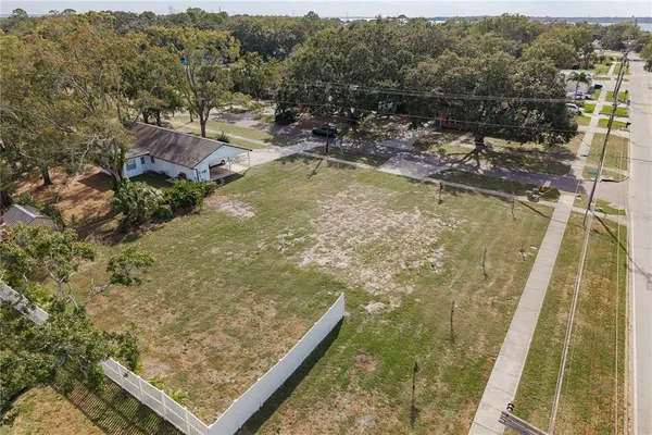 a view of a swimming pool with a yard