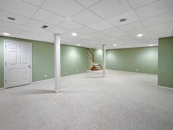 an empty room with a mirror