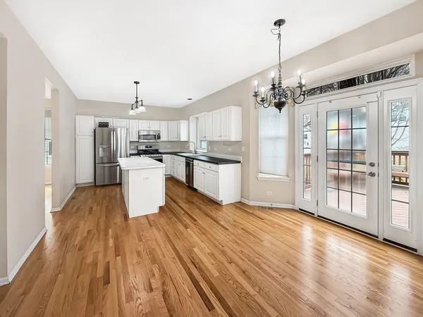 a view of a kitchen with wooden floor
