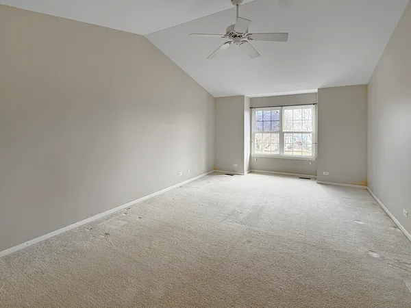 an empty room with a empty space and windows