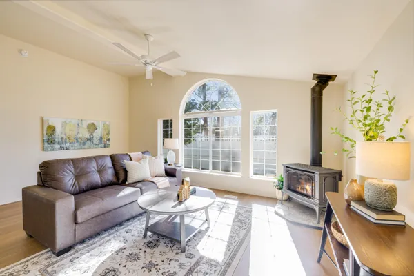 a living room with furniture and a large window
