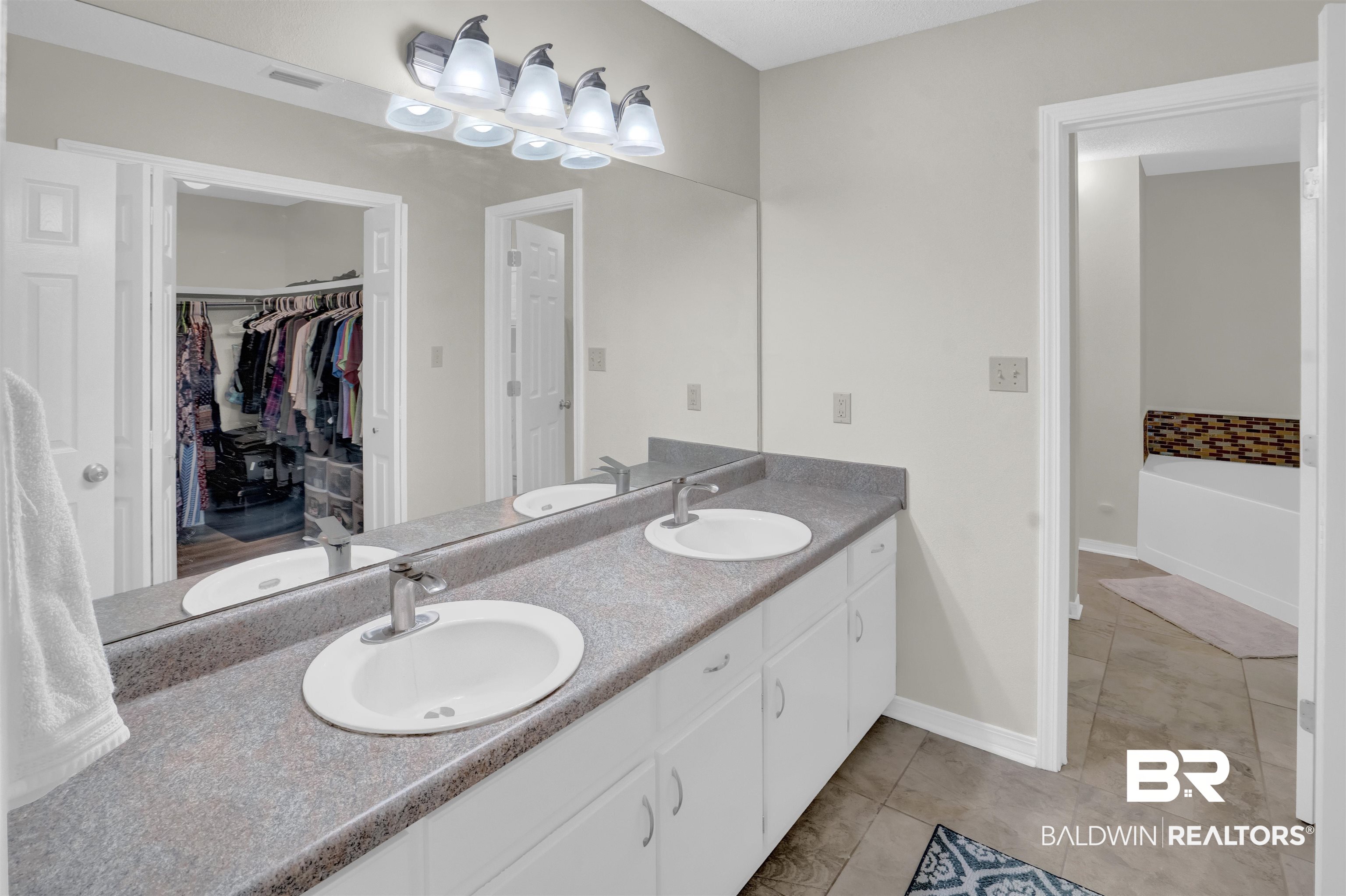 30871 Stanton Road Spanish Fort, AL 36527 - Photo 27 of 35 Bathroom featuring tile patterned flooring and vanity