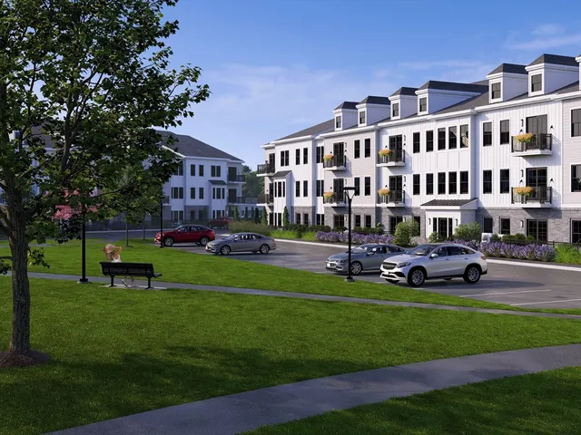 a front view of building with yard and green space