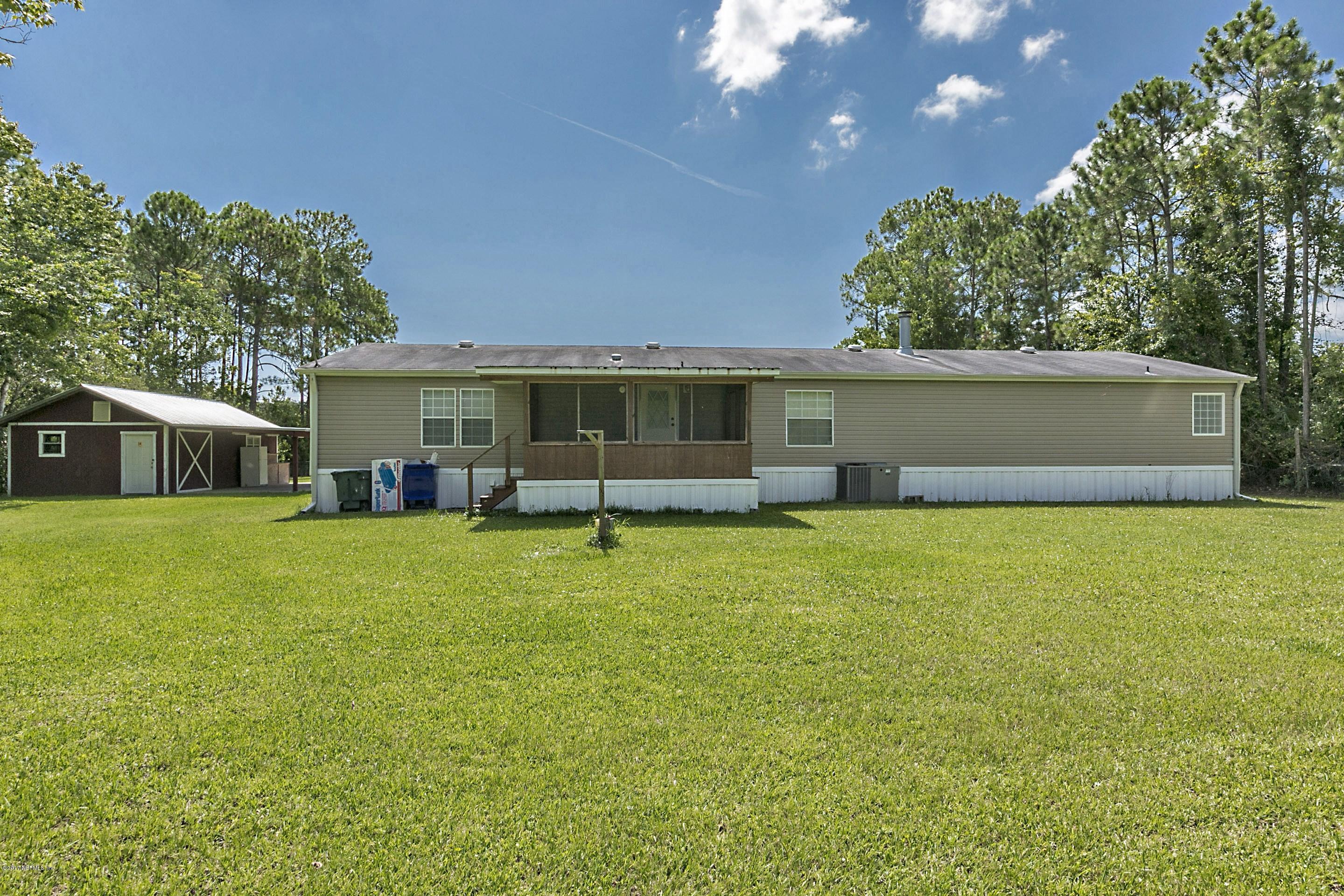 324 Dusty Road St. Augustine, FL 32095 - Photo 6 of 26 a front view of house with a garden