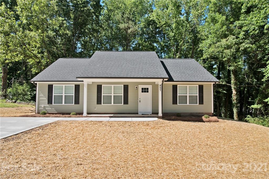 131 Powder Street Southwest Concord, NC 28025 - Photo 2 of 29 a front view of a house with a yard