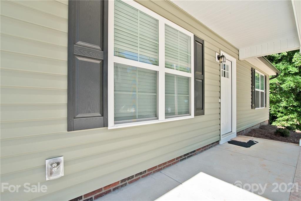 131 Powder Street Southwest Concord, NC 28025 - Photo 19 of 29 a front view of a house with a yard