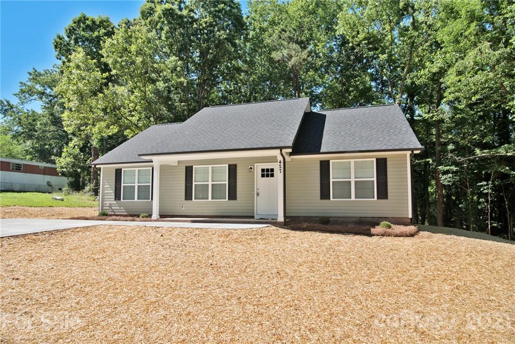 131 Powder Street Southwest Concord, NC 28025 - Photo 3 of 29 a front view of a house with a yard