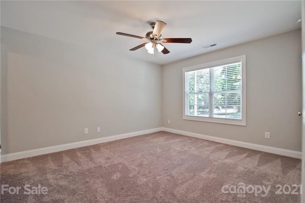 131 Powder Street Southwest Concord, NC 28025 - Photo 23 of 29 a view of an empty room with a window