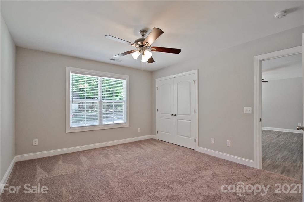 131 Powder Street Southwest Concord, NC 28025 - Photo 4 of 29 a view of an empty room with a window