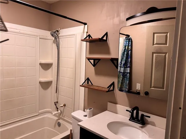 a view of a storage and utility room with a window