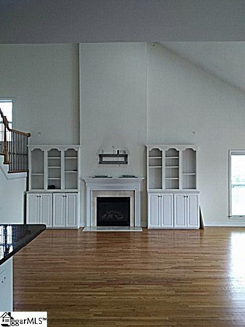 503 Gladstone Way Greer, SC 29650 - Photo 16 of 27 open floor plan with fireplace