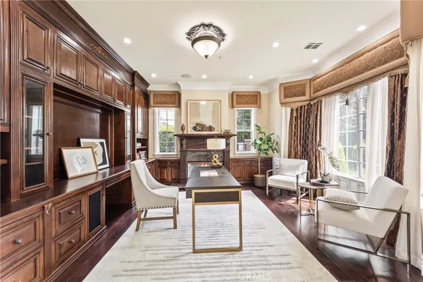 a living room with furniture a fireplace and a table
