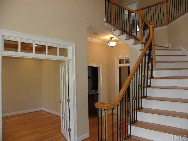 7009 Millstone Ridge Court Raleigh, NC 27614 - Photo 3 of 25 a view of entryway and hall with wooden floor