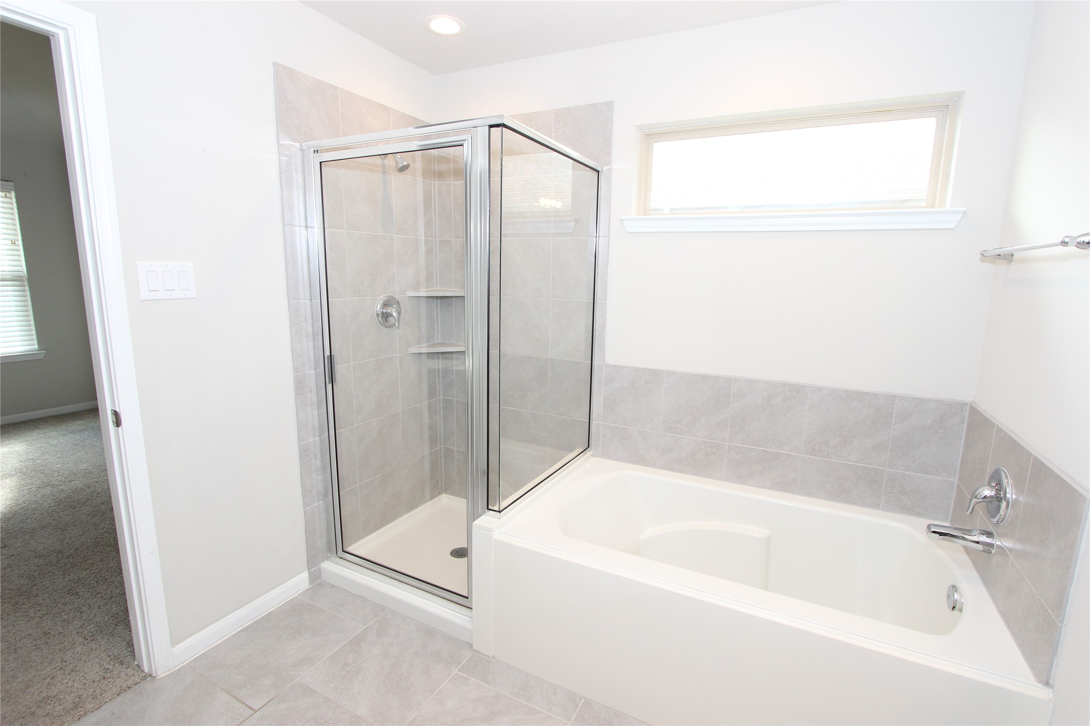 1303 Keaton Court Rosenberg, TX 77469 - Photo 10 of 22 a bathroom with a bathtub and a shower