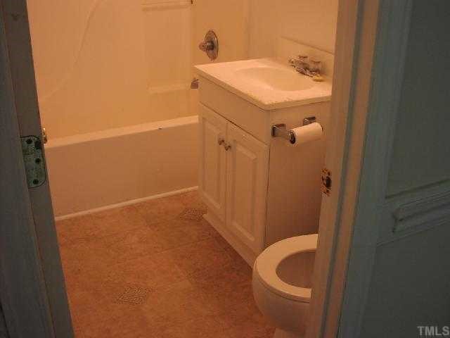 525 Steel Street Raleigh, NC 27603 - Photo 6 of 9 a bathroom with a sink and a mirror