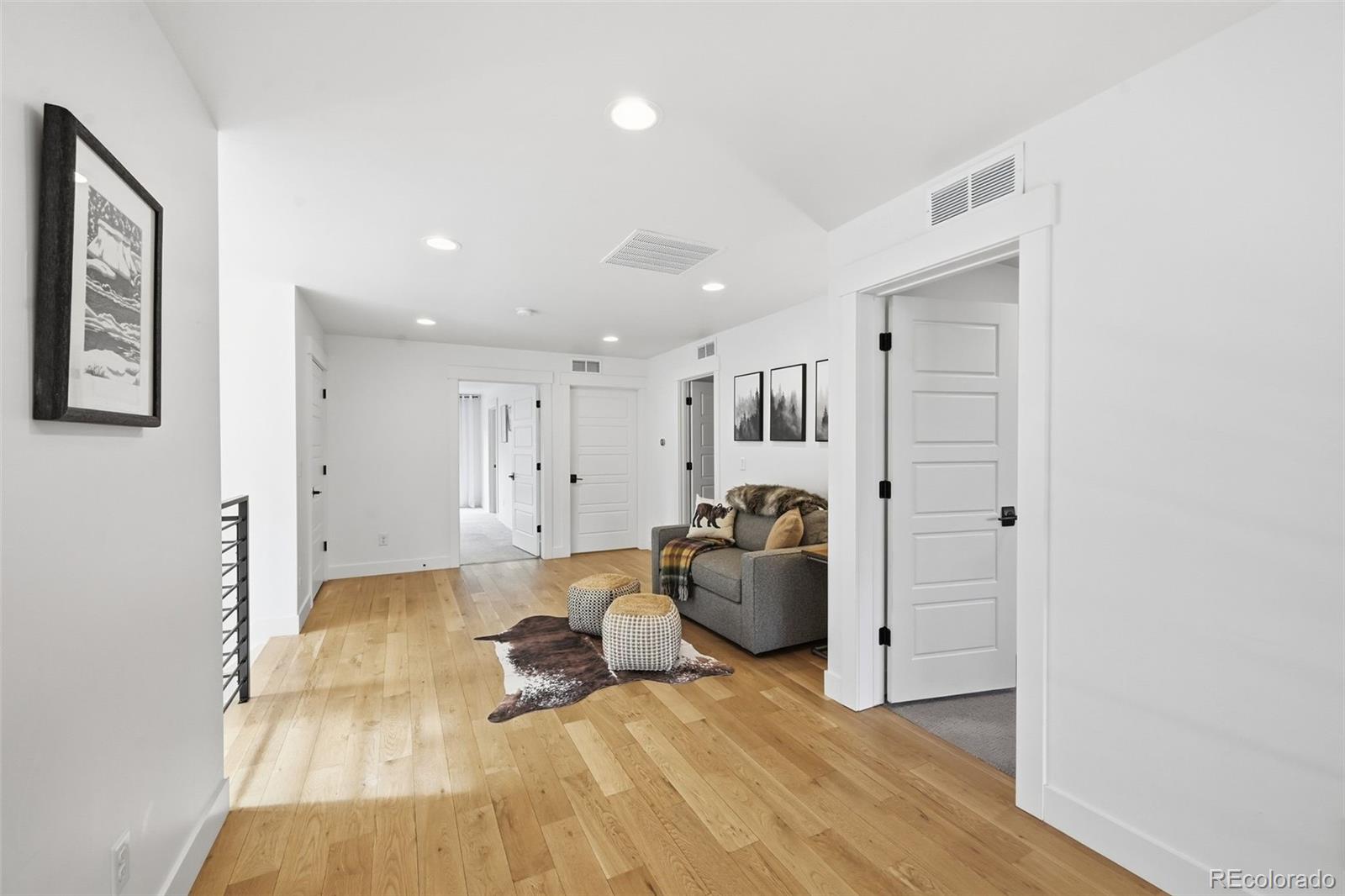 2757 South Steele Street Denver, CO 80210 - Photo 24 of 50 a living room with furniture a refrigerator and a table