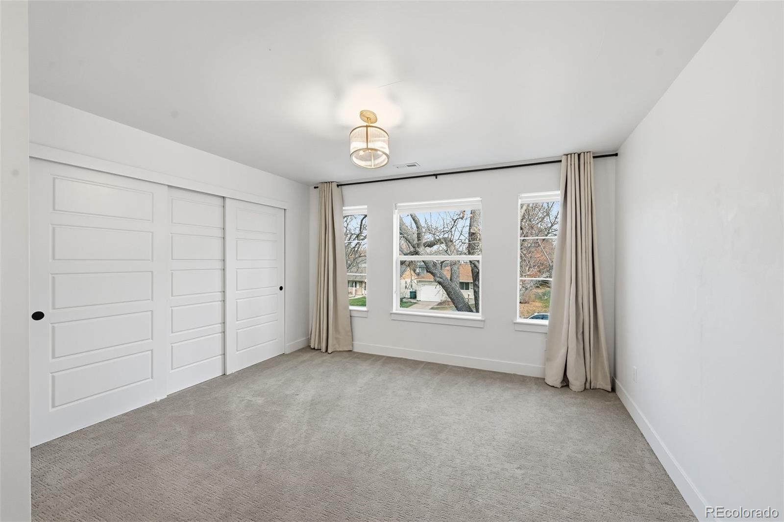 2757 South Steele Street Denver, CO 80210 - Photo 25 of 50 an empty room with windows