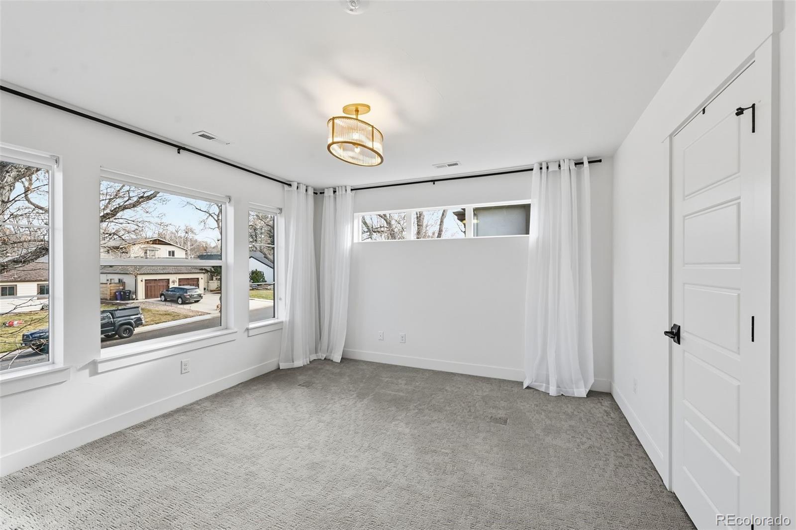 2757 South Steele Street Denver, CO 80210 - Photo 28 of 50 a view of an empty room with a window
