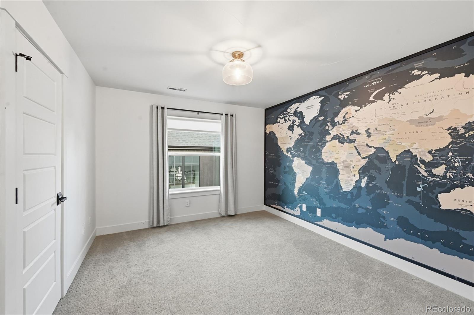 2757 South Steele Street Denver, CO 80210 - Photo 30 of 50 wooden floor in an empty room with a window