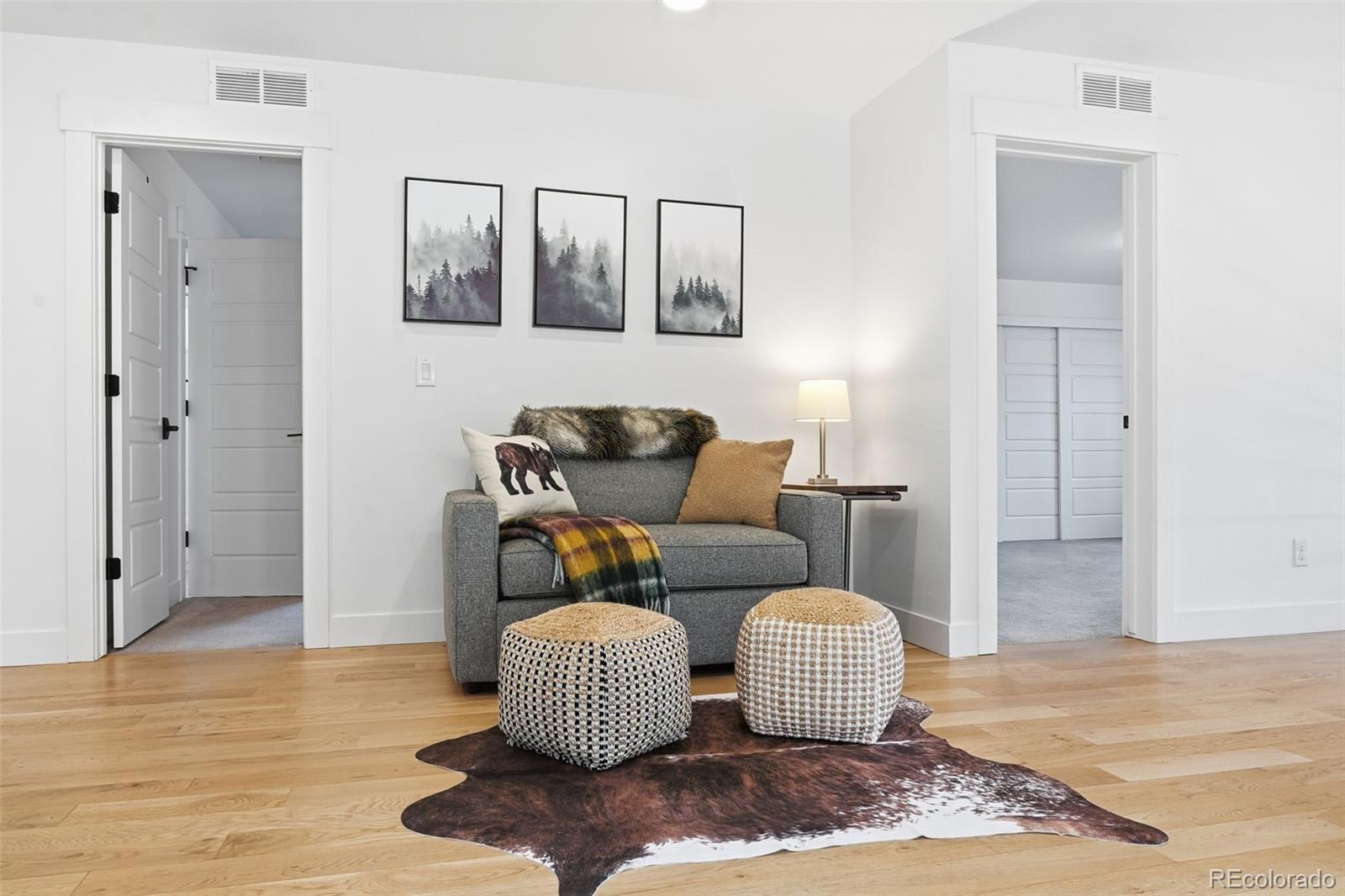 2757 South Steele Street Denver, CO 80210 - Photo 3 of 50 a living room with furniture and a wooden floor