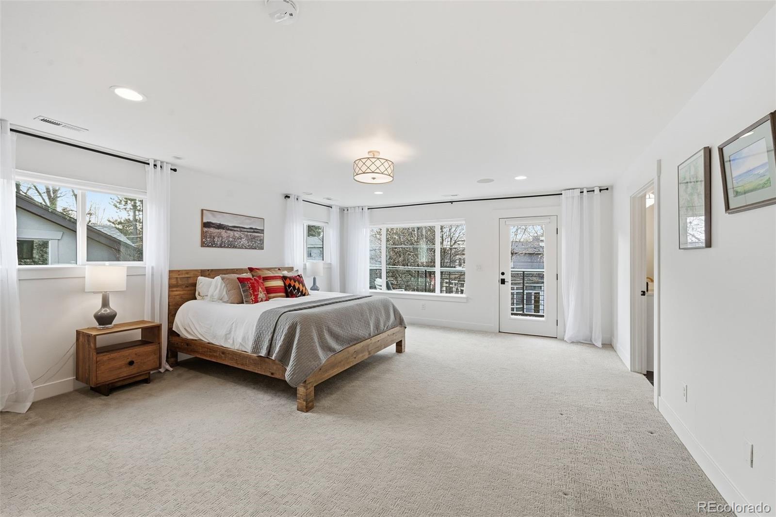 2757 South Steele Street Denver, CO 80210 - Photo 33 of 50 a bed room with a bed and a chair