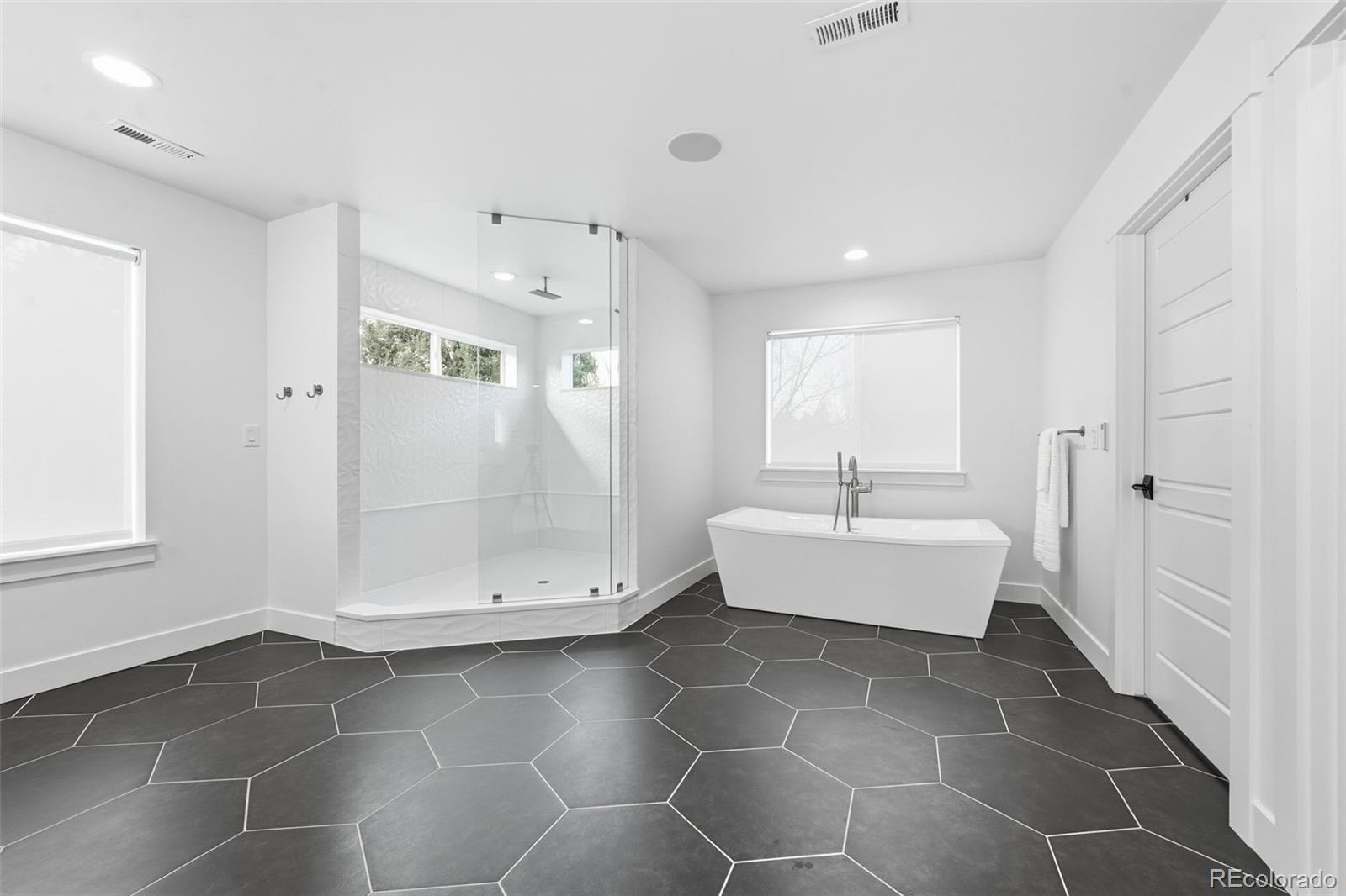 2757 South Steele Street Denver, CO 80210 - Photo 35 of 50 a bathroom with a bathtub and a shower