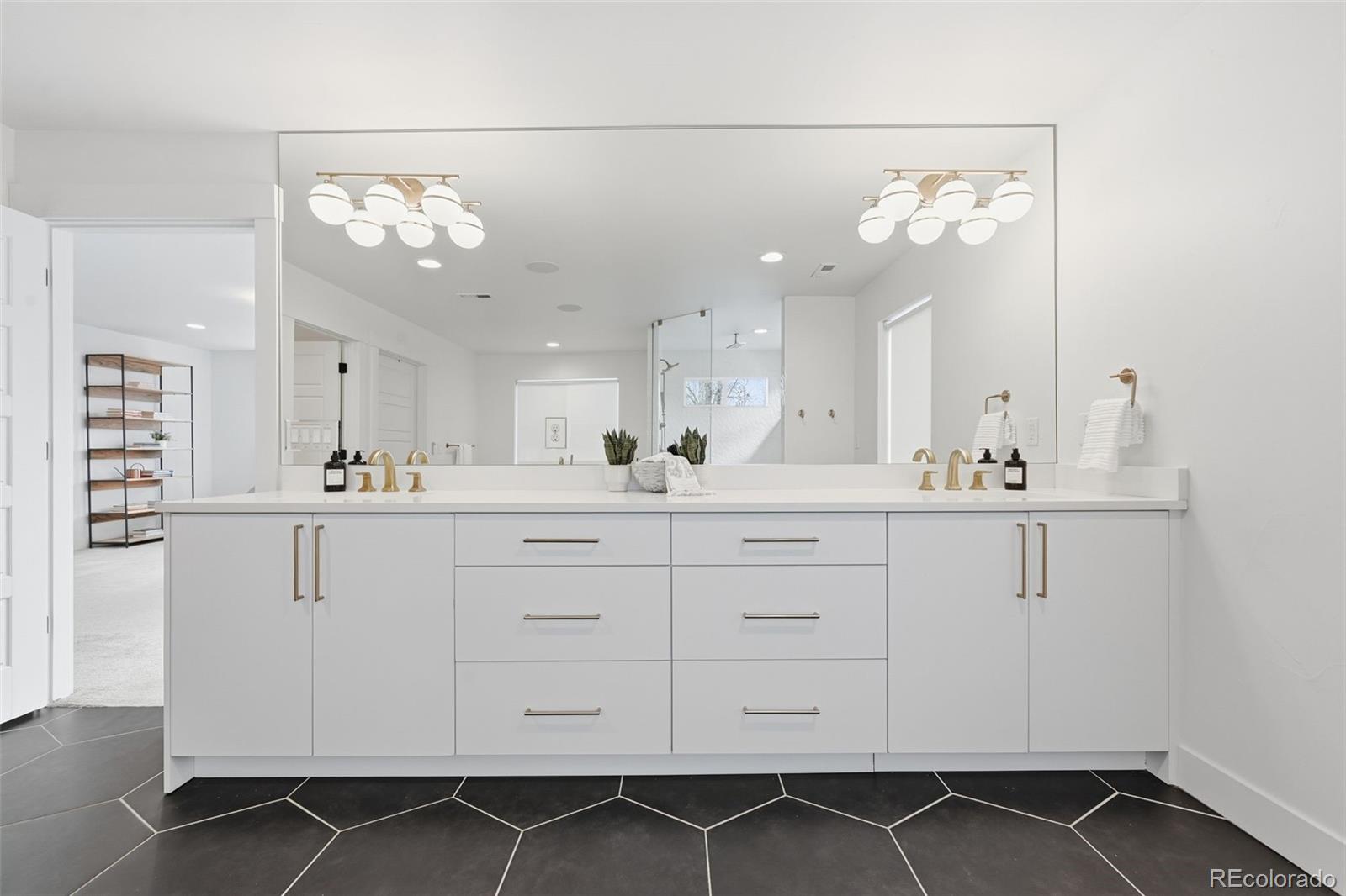 2757 South Steele Street Denver, CO 80210 - Photo 37 of 50 a bathroom with a sink vanity and a mirror