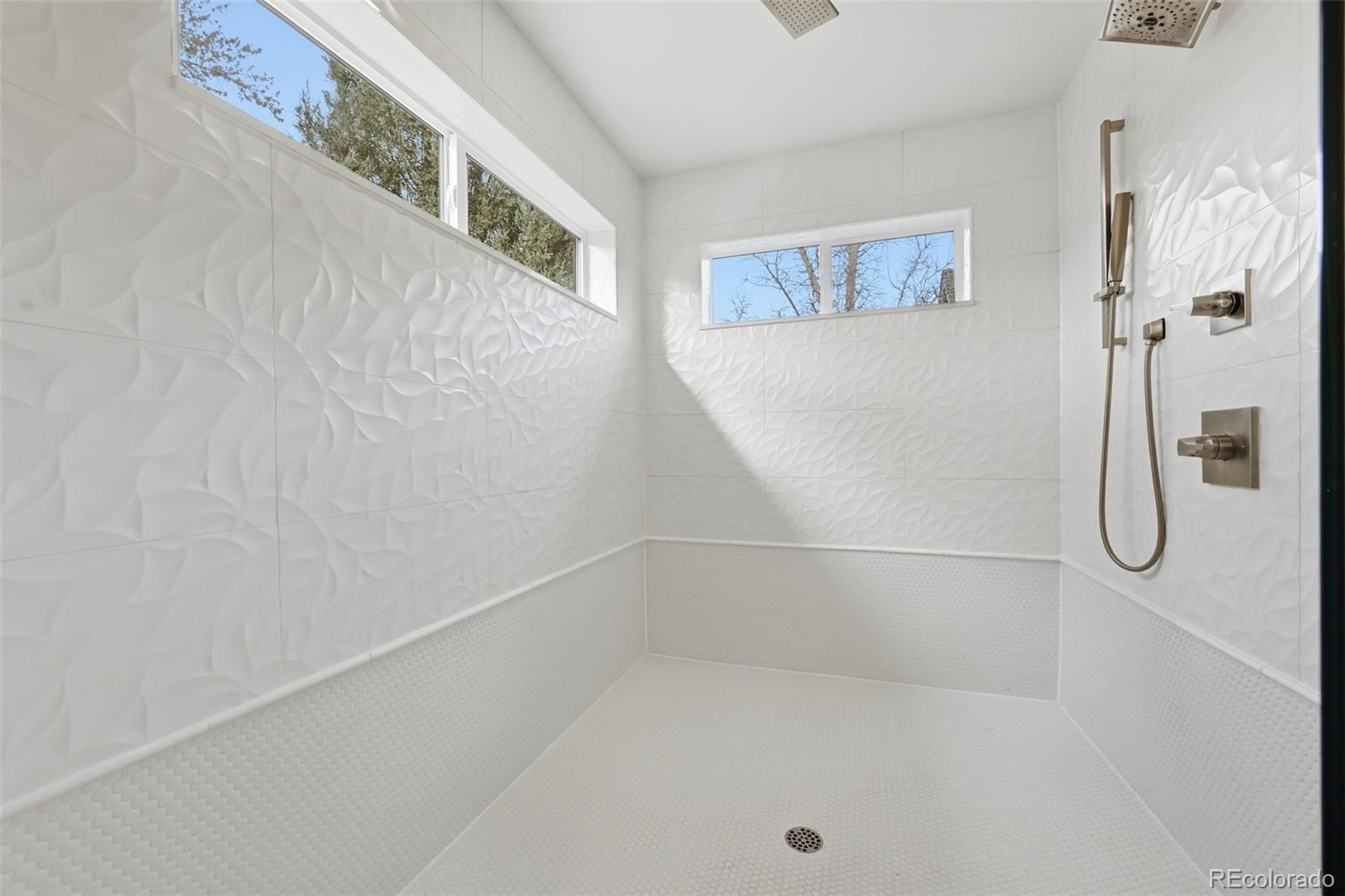 2757 South Steele Street Denver, CO 80210 - Photo 38 of 50 a bathroom with a shower