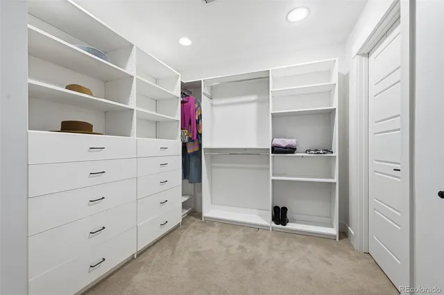 a backyard of a house with barbeque oven table and chairs