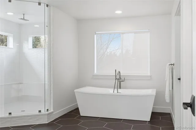a white bath tub sitting in a bathroom