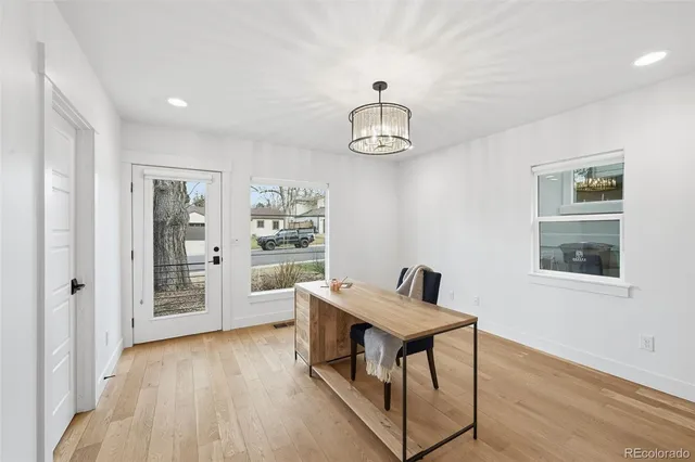 a view of a livingroom with furniture wooden floor and a window