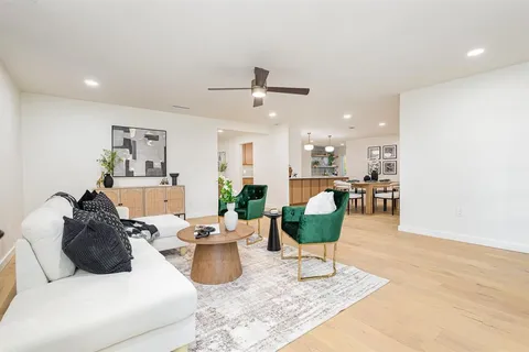 a living room with furniture and a table