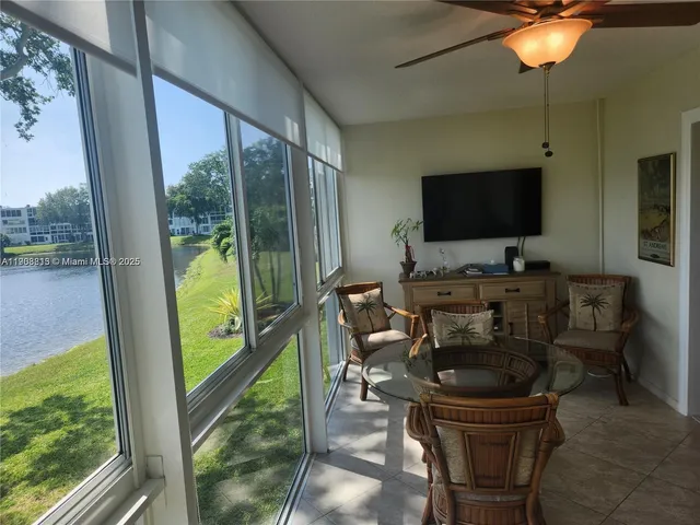 a work room with furniture and a flat screen tv
