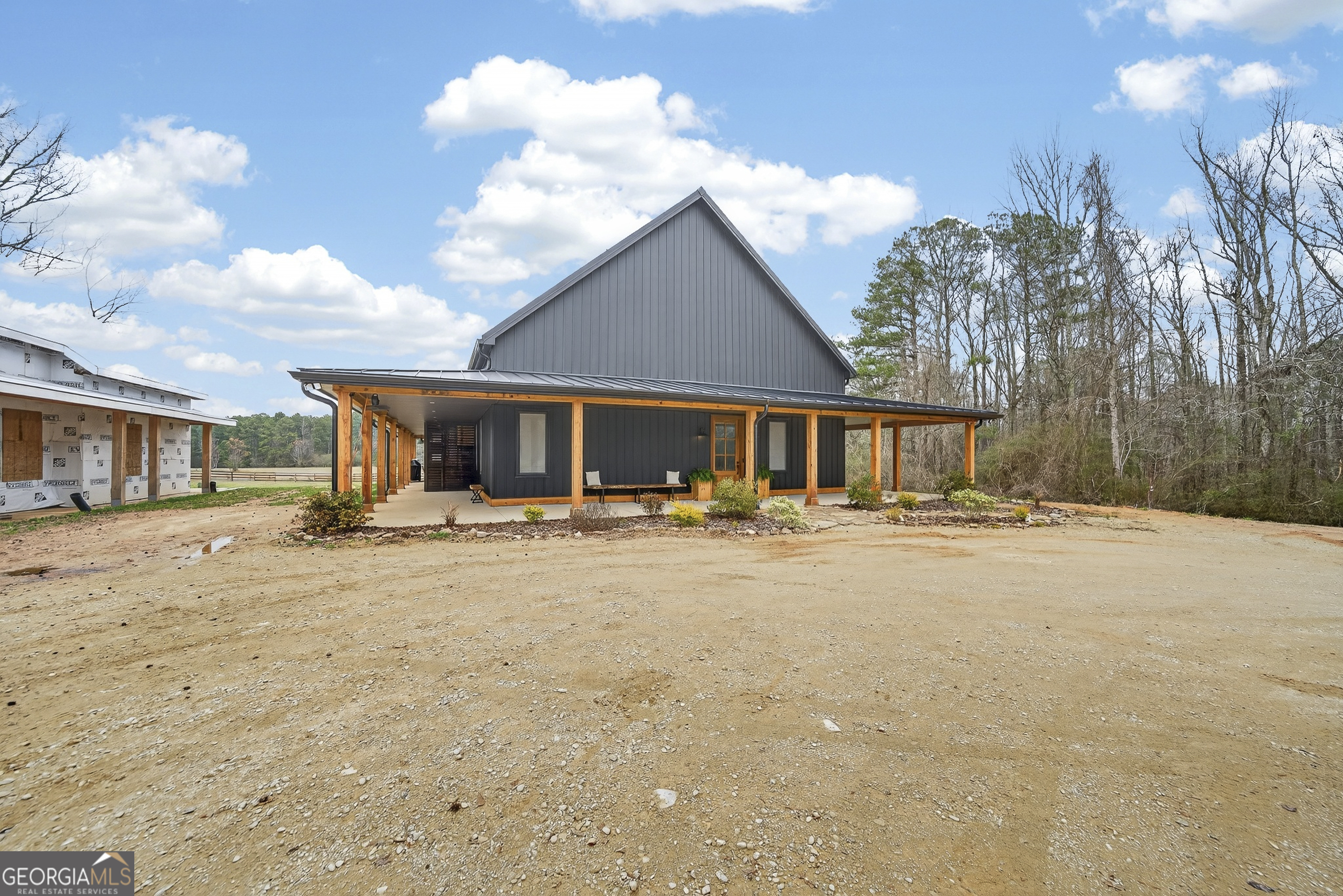 1570 Eley Road White Plains, GA 30678 - Photo 1 of 43 a front view of a house with yard patio and fire pit