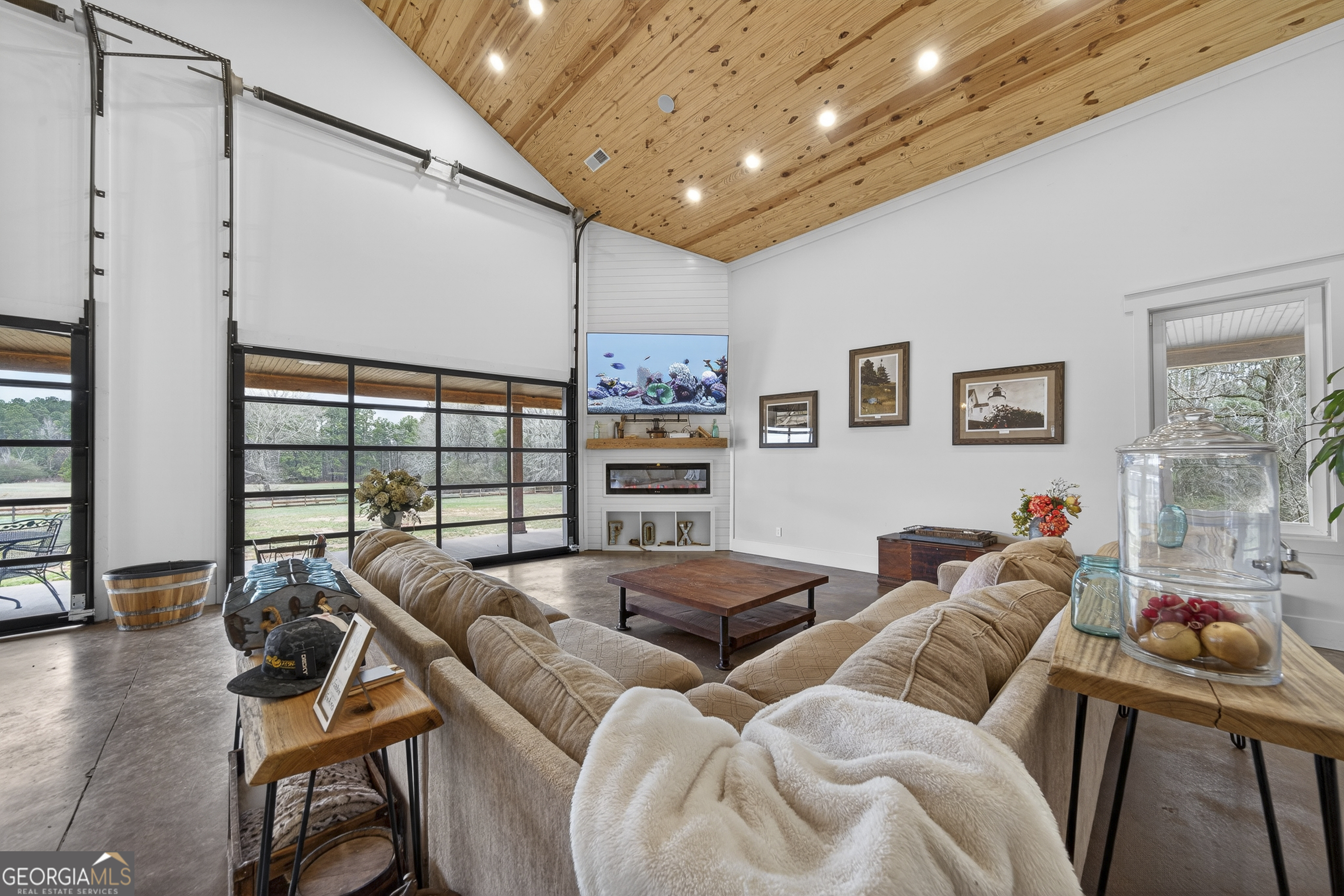1570 Eley Road White Plains, GA 30678 - Photo 11 of 43 a living room with furniture a flat screen tv and a large window