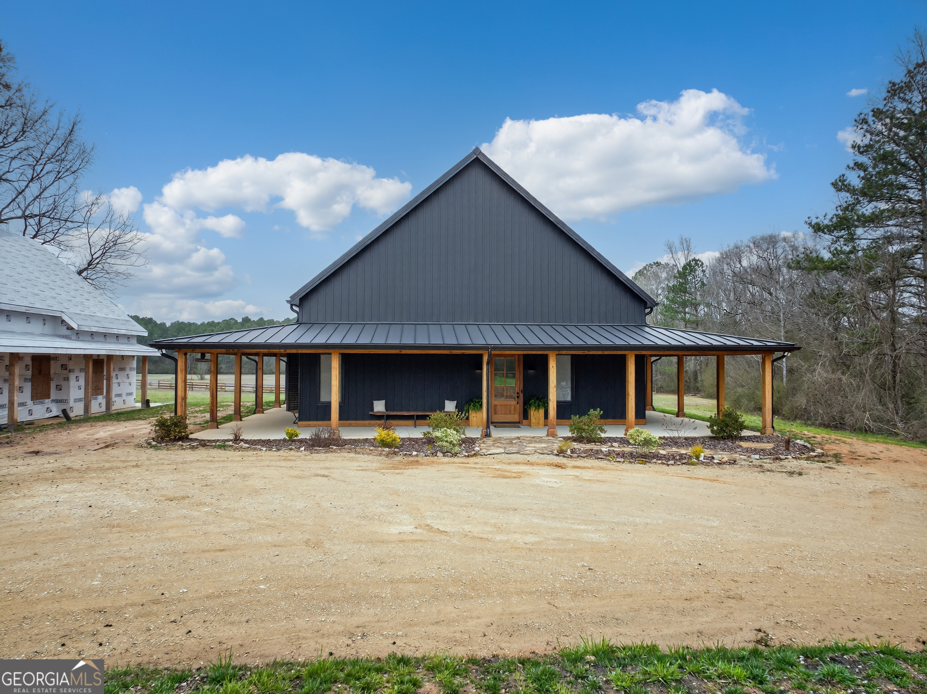 1570 Eley Road White Plains, GA 30678 - Photo 19 of 43 a front view of a house with a patio