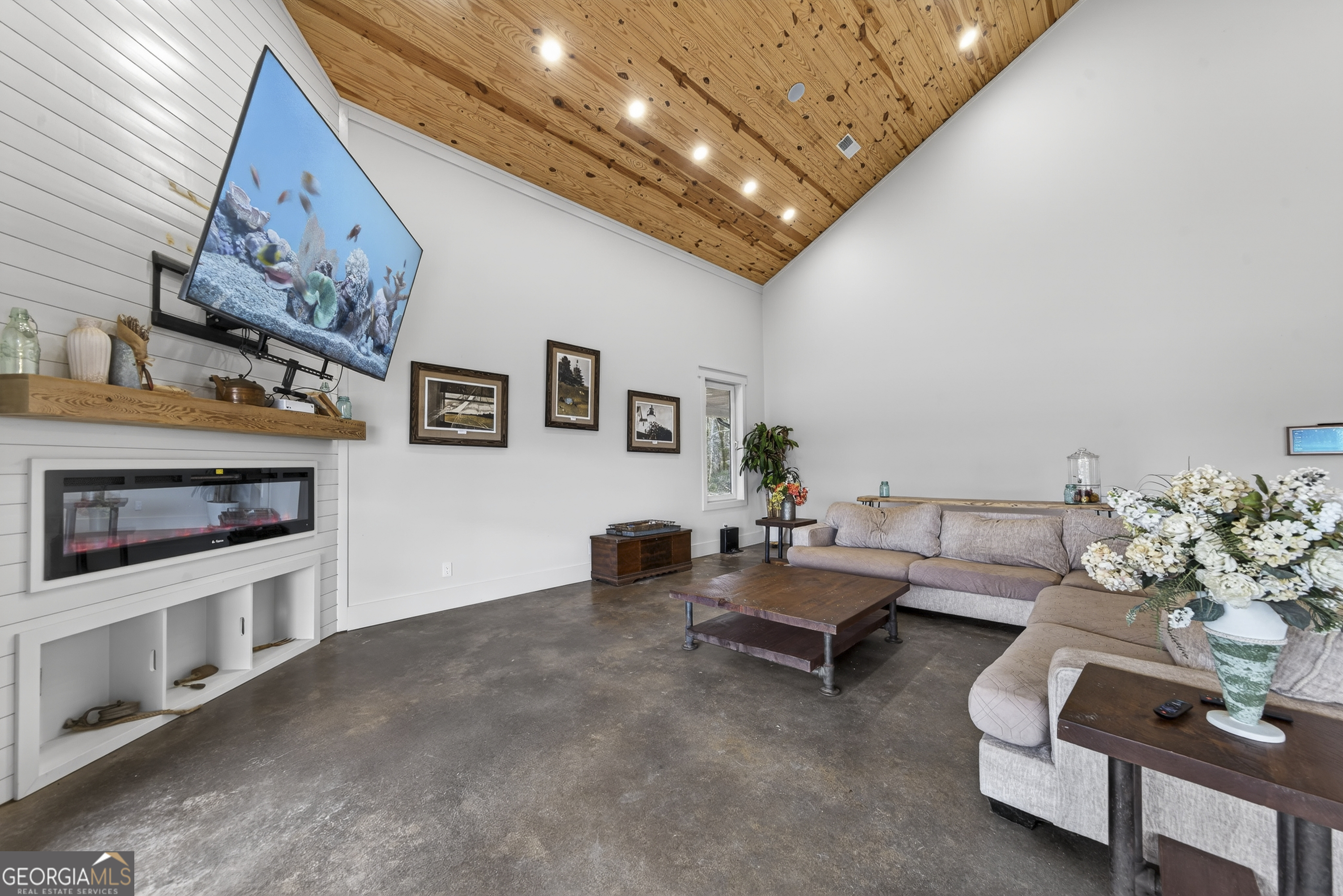 1570 Eley Road White Plains, GA 30678 - Photo 22 of 43 a living room with furniture and a flat screen tv
