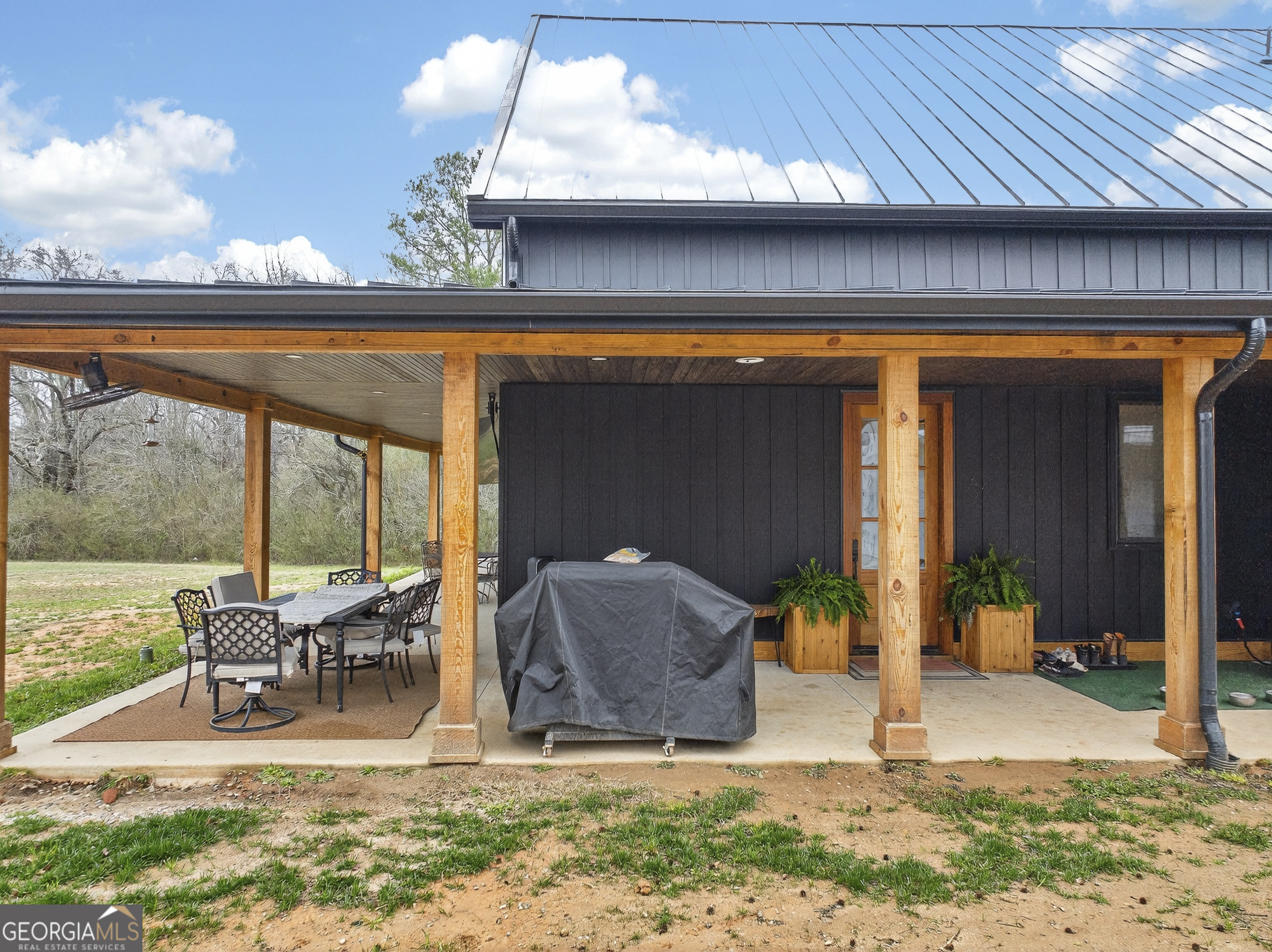 1570 Eley Road White Plains, GA 30678 - Photo 23 of 43 a view of a patio with table and chairs near a barbeque