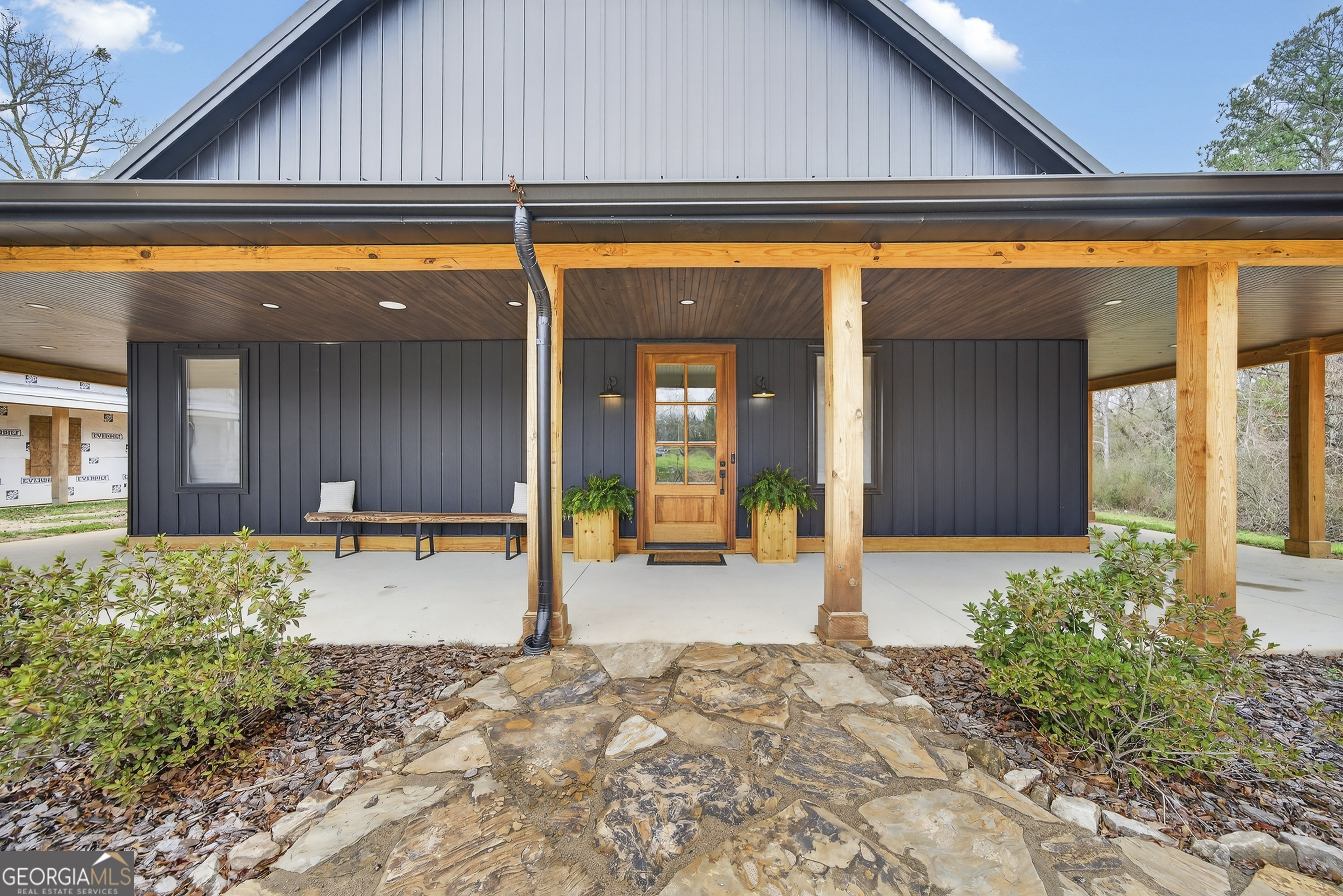 1570 Eley Road White Plains, GA 30678 - Photo 28 of 43 a backyard of a house with basket ball outdoor dining table and chairs