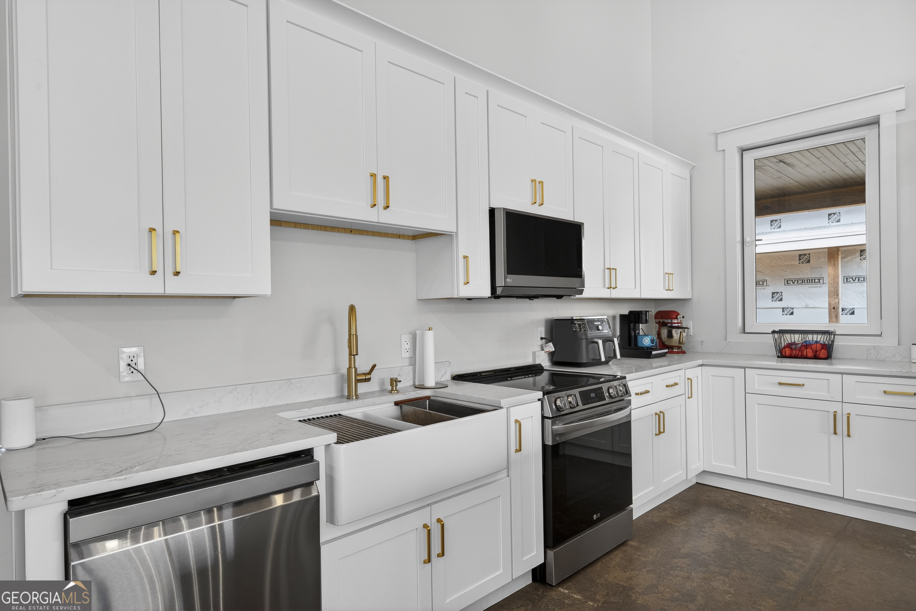 1570 Eley Road White Plains, GA 30678 - Photo 29 of 43 a kitchen with white cabinets stainless steel appliances and sink